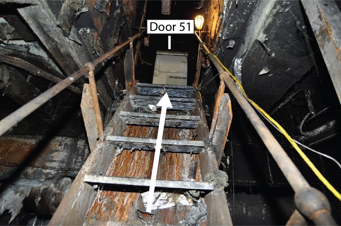 Close-up view of the stairs that the crew used to exit the engine room. Door 51 is at the top of the stairs. (Source: TSB)