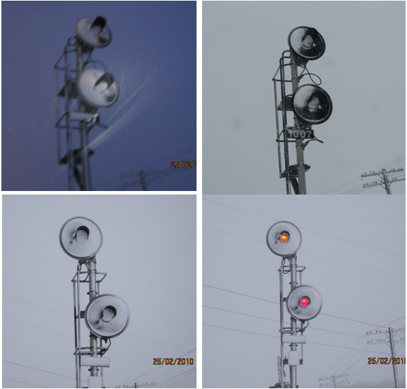 Photo 2 - Haut - Neige sur la lentille du signal d'entrée 1007 (25 février 2010 é 7 h et é 11 h 30) Bas - Signal avancé 971 avant et aprés le nettoyage des lentilles (Source : BST et CN) 