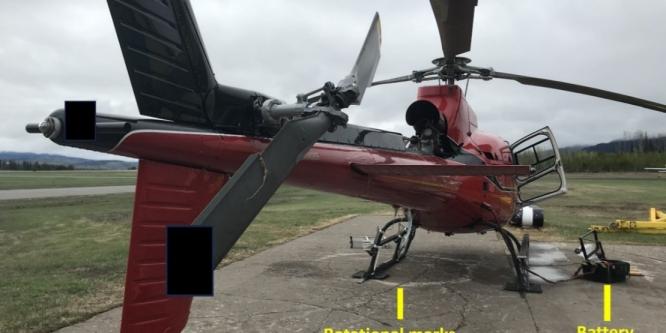 Figure 1. The occurrence helicopter shortly after the loss of control (Source: Smithers Royal Canadian Mounted Police [RCMP], with TSB annotations)
